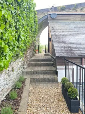 a stairway leading to an archway in a building at The Old Smelting Works in Truro