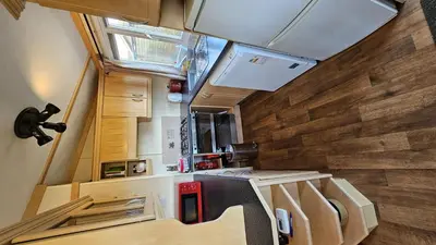 an interior view of a kitchen in a tiny house at Penmor in Bude