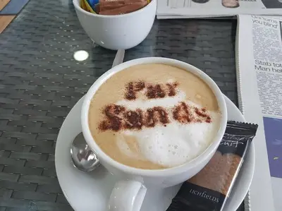 a cup of coffee with the words eat carrots written on it at Delightful two bedroom caravan on Par Beach. in Par