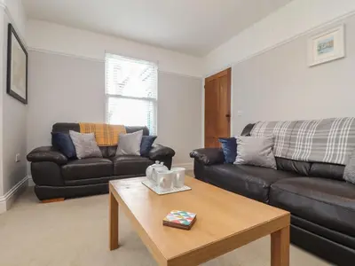 a living room with a couch and a coffee table at The Mordon in Newquay