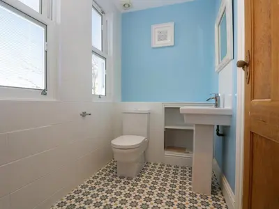 a bathroom with a toilet and a sink at The Mordon in Newquay