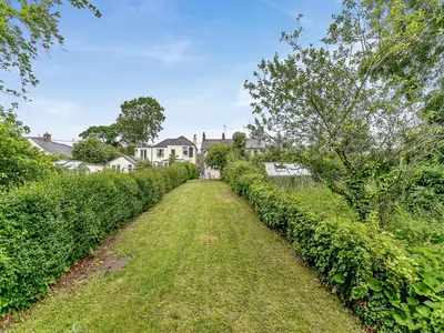 a field of hedges next to a house at Country View in Saint Erth