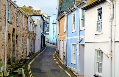 a narrow alley with buildings in a city at A Cosy Period Family Cottage in St Ives Town, sleeps 4, pet friendly in St Ives