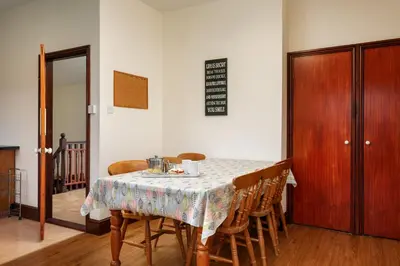 a dining room table with chairs and a table cloth at Lanjew Park in Bodmin