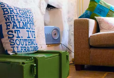 a living room with a couch and a chair at St Ives fisherman cottage, Sleeps 5, pet friendly in St Ives