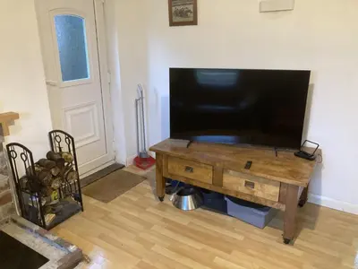 a living room with a large flat screen tv at Little Haven in Launceston