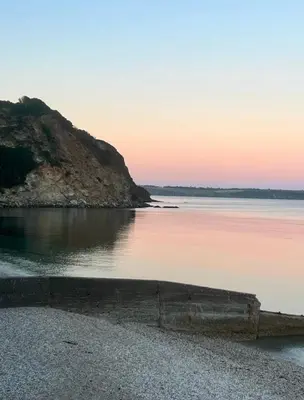 a view of a body of water at sunset at Captains Quarters in Charlestown