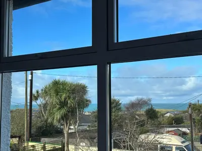 a window view of the ocean from a house at Porth View Newquay in Saint Columb Minor