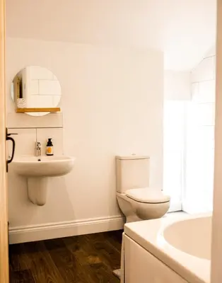 a bathroom with a toilet and a sink at Glynn Bull Pen in Bodmin