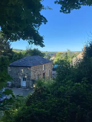 an old stone house in the middle of a forest at Glynn Bull Pen in Bodmin