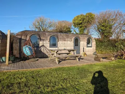 a shadow of a person in front of a yurt at Clotted Cream -Lydcott Glamping, Cornish Sea Views in Looe