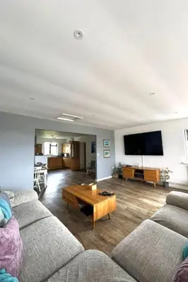 a living room with two couches and a coffee table at Holiday Home Francis Bungalow by Interhome in Helston
