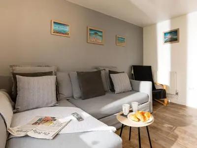 a living room with a couch and a table at Chalet Lodge 2 by Interhome in Helston