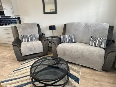 a living room with a couch and a coffee table at HeyRic in Padstow