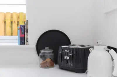 a toaster sitting on a counter next to a window at Abelia in St Ives