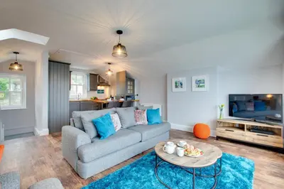 a living room with a couch and a table at 1 Bed in Fowey oc-p00802 in Fowey