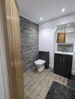 a bathroom with a toilet and a sink at Truckle - Treknow, Tintagel - Bungalow in North Cornwall (Sleeps 5 - 7) in Treknow