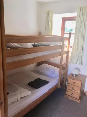 a couple of bunk beds in a room at Goodrevy Barn in Launceston
