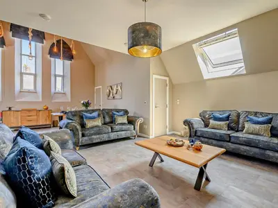 a living room with couches and a table at 3 Bed in Newquay oc-90068 in Newquay