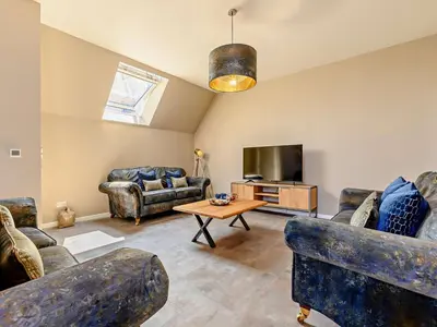 a living room with couches and a tv at 3 Bed in Newquay oc-90068 in Newquay