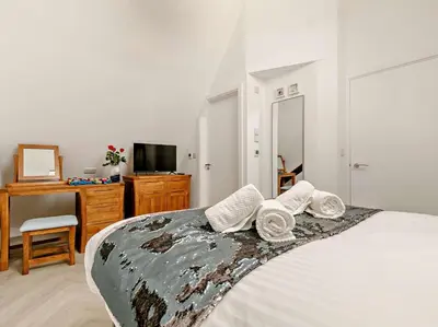 a bedroom with a bed with two pillows on it at 3 Bed in Newquay oc-90070 in Newquay