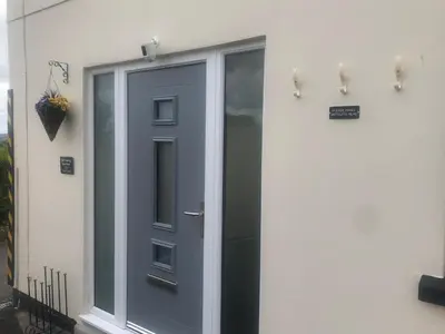 a door on the side of a house at Beacon Hotel Self Catering Apartment in St. Agnes