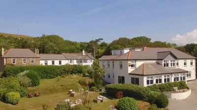 an aerial view of a large white house at Beacon Hotel Self Catering Apartment in St. Agnes