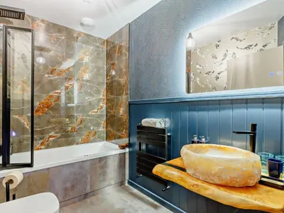a bathroom with a tub and a sink at 4 Bed in Newquay oc-90069 in Newquay