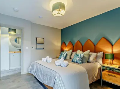 a bedroom with a large bed with a large headboard at 4 Bed in Newquay oc-90069 in Newquay