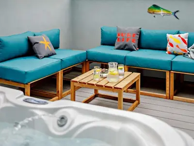 a living room with blue couches and a coffee table at 4 Bed in Newquay oc-90069 in Newquay