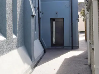 a doorway to a building with a blue wall at 4 Bed in Newquay oc-90069 in Newquay