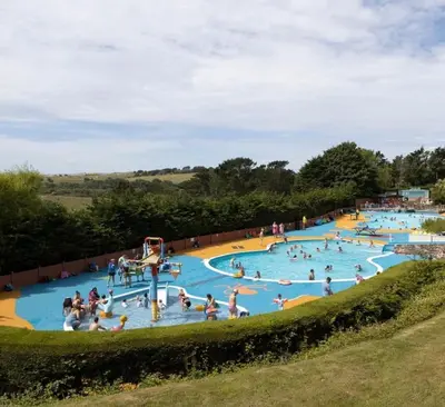 a group of people playing in a water park at Willows Way Newquay Holiday Park in Newquay