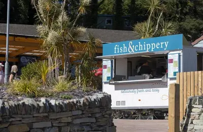 a food truck with a person inside of it at Willows Way Newquay Holiday Park in Newquay