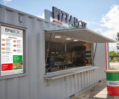 a fast food restaurant with a large window at Willows Way Newquay Holiday Park in Newquay