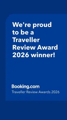 a blue sign that says were proud to be a traveller reviewagency winner at Willows Way Newquay Holiday Park in Newquay