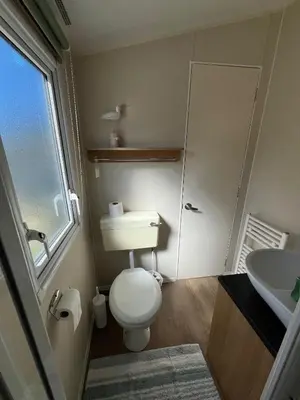 a bathroom with a white toilet and a sink at Willows Way Newquay Holiday Park in Newquay