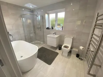 a bathroom with a sink and a toilet and a shower at Bed and breakfast near Truro and the A30 in Truro