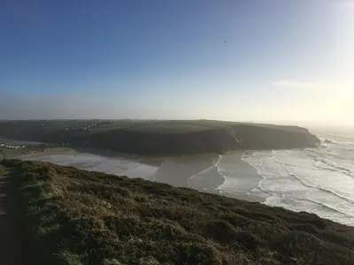 a view of a beach with the ocean at Cosy Cornish cottage with rural views in Newquay