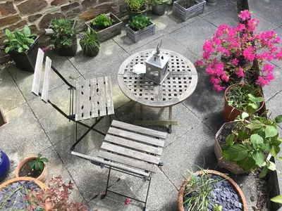 an overhead view of a table and chairs and potted plants at Number Six in St. Agnes