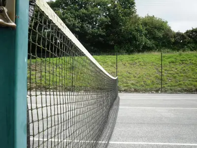 a net on the side of a tennis court at Villa Gallery in Truro