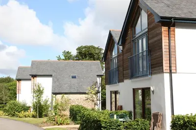 a house with black and white at Haven in Truro