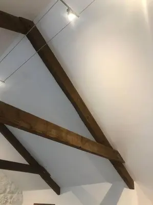 a wooden beam on the ceiling of a room at The Loft - Bright apartment centre St Ives sleep 4 in St Ives