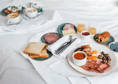 a breakfast table with a plate of breakfast foods at St Michaels Resort, Falmouth in Falmouth