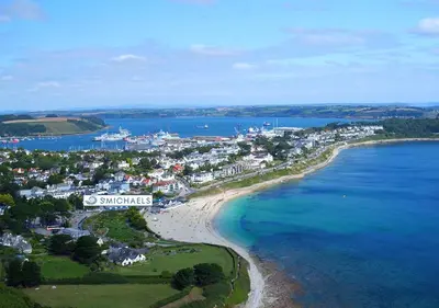 an aerial view of a town on the beach at St Michaels Resort, Falmouth in Falmouth