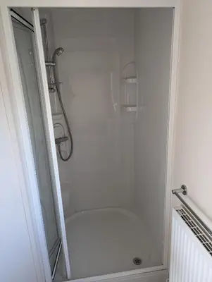 a shower with a glass door in a bathroom at 11 Meadow View in Newquay