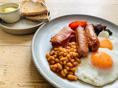 a plate of breakfast food with eggs beans and toast at St Agnes Hotel in St. Agnes