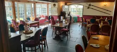a room with tables and chairs in a restaurant at Two Bedroom Lodge In The Country - Restaurant Bar Onsite in Liskeard