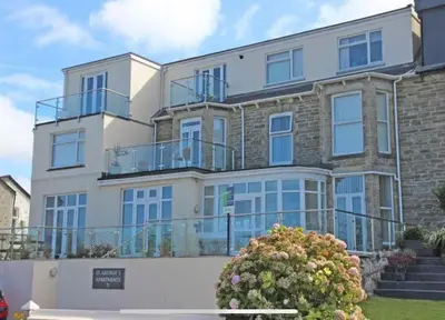 a large apartment building with balconies on it at Flat in the heart of Newquay in Newquay