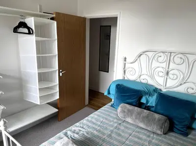 a bedroom with a bed and a book shelf at Flat in the heart of Newquay in Newquay