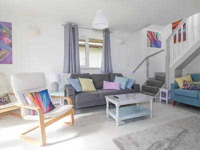 a living room with a couch and a chair at Rainbow Lodge in Bodmin